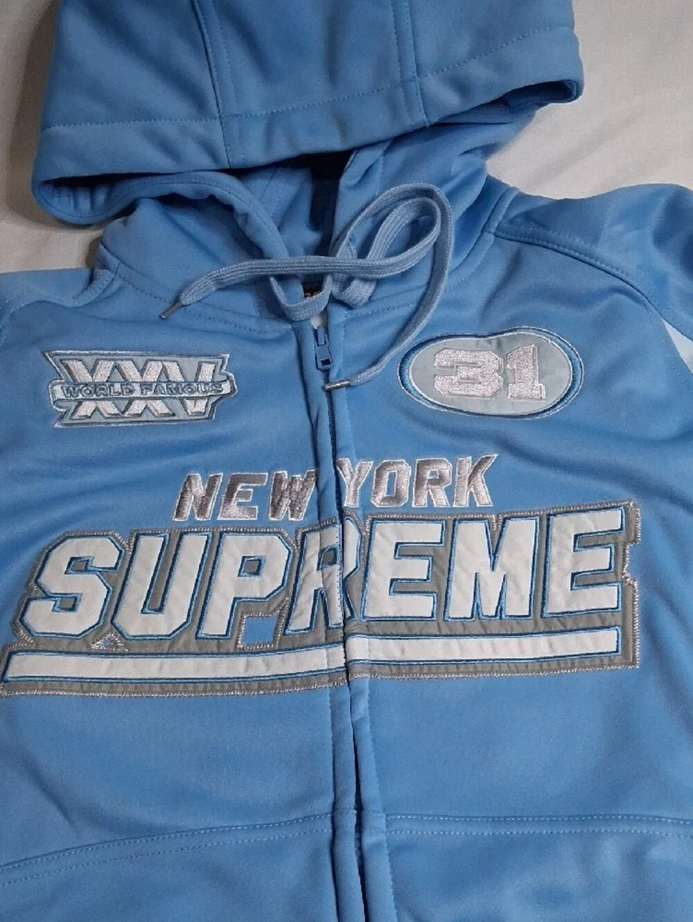 Supreme Light Blue Zip-Up Hoodie with Racing Patches